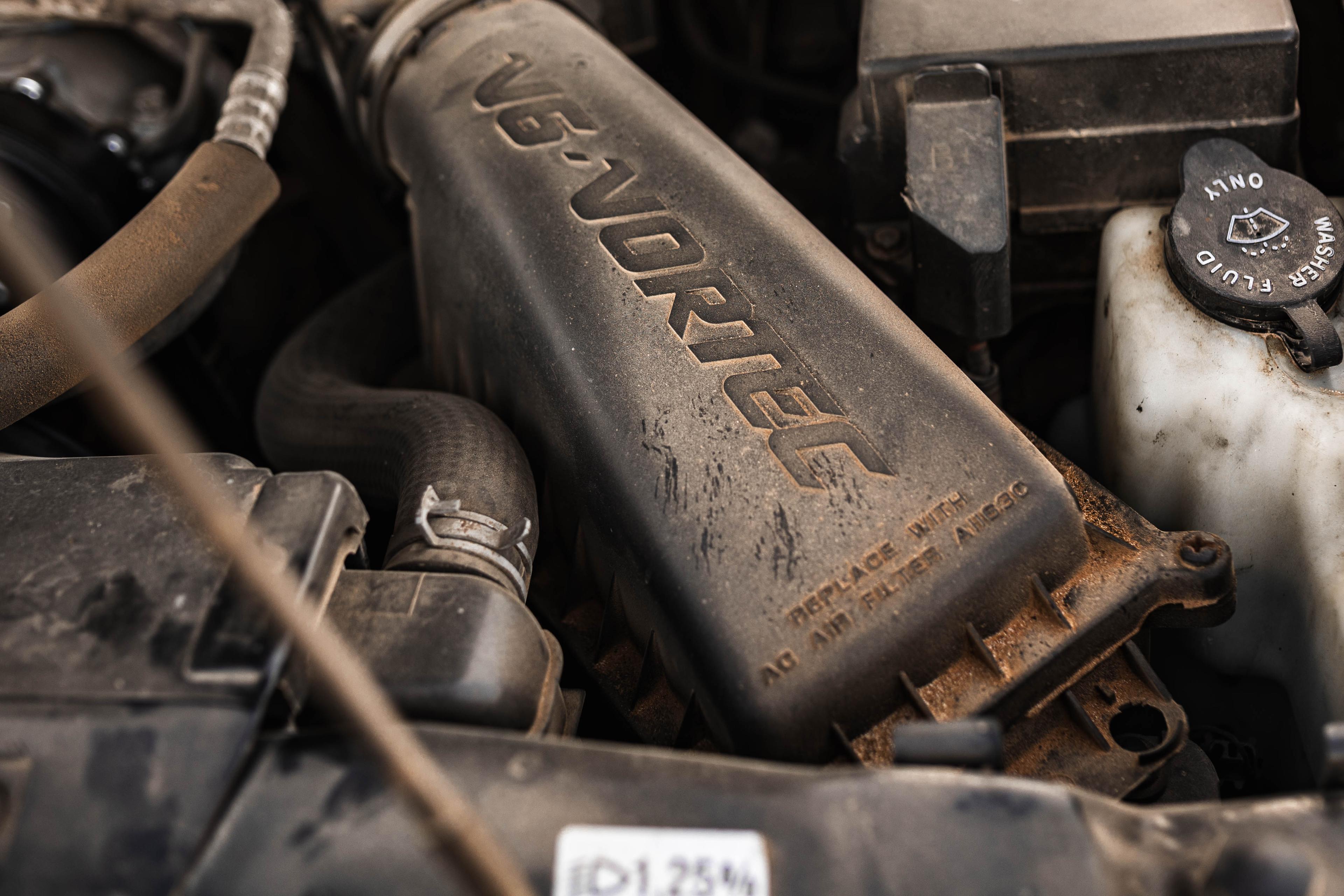 Close-up of the engine bay of an old Chevy Blazer, representing the idea of looking under the hood of an AppSec program to clarify ownership.