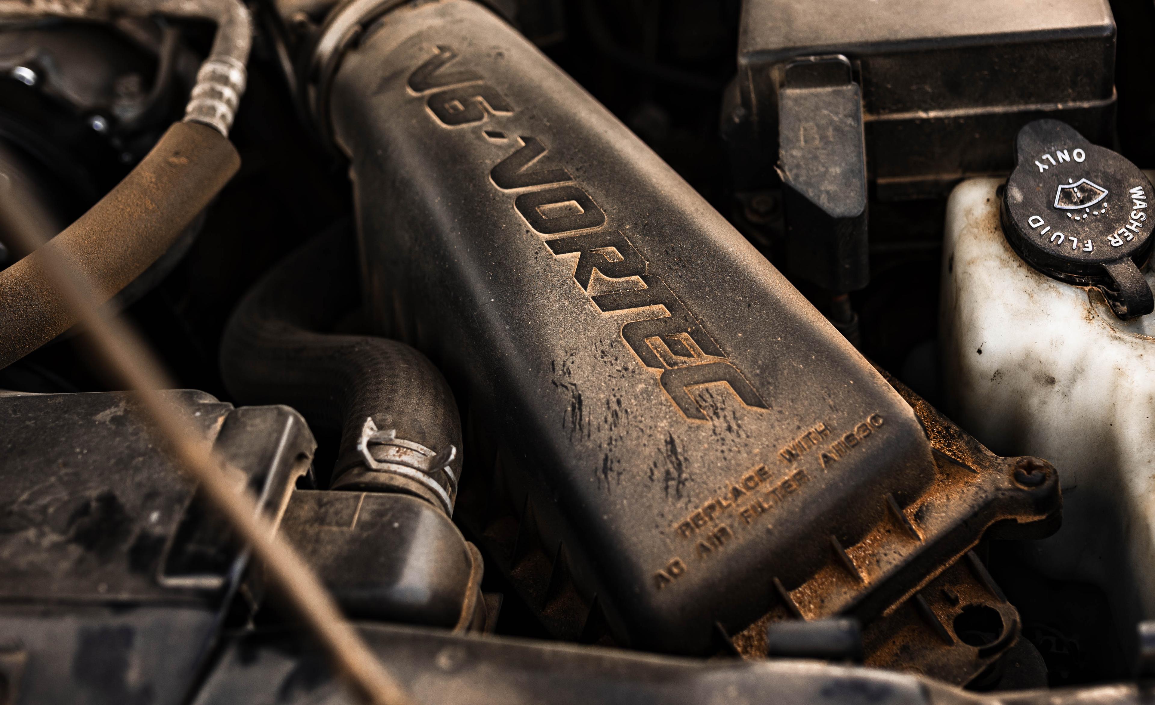 Close-up of the engine bay of an old Chevy Blazer, representing the idea of looking under the hood of an AppSec program to clarify ownership.
