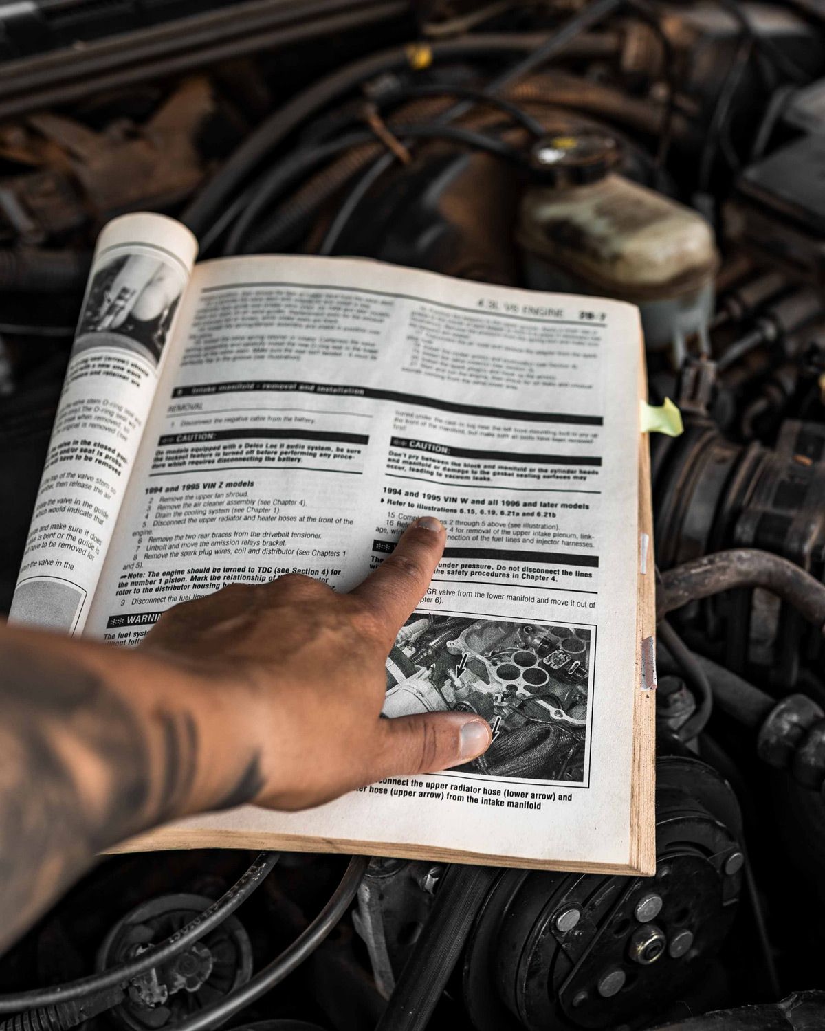 Repair manual for AppSec Ownership Close-up of the repair manual for an old Chevy Blazer, representing the idea of looking under the hood of an AppSec program to clarify ownership.