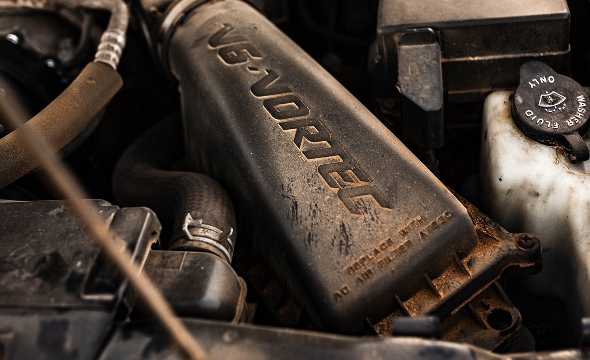 Looking under the hood to clarify AppSec ownership. Close-up of the engine bay of an old Chevy Blazer, representing the idea of looking under the hood of an AppSec program to clarify ownership.